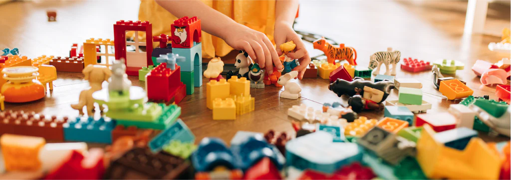 A child engaged in a quick, five-minute learning activity with colorful bricks.